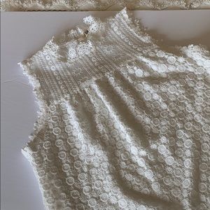 Sleeveless white lace top